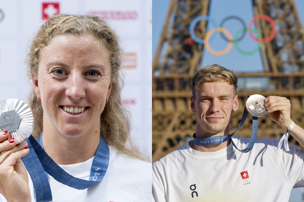 Derron und Mityukov tragen Fahne bei der Schlussfeier